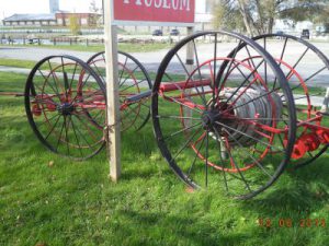 Two hand-drawn hose reels.